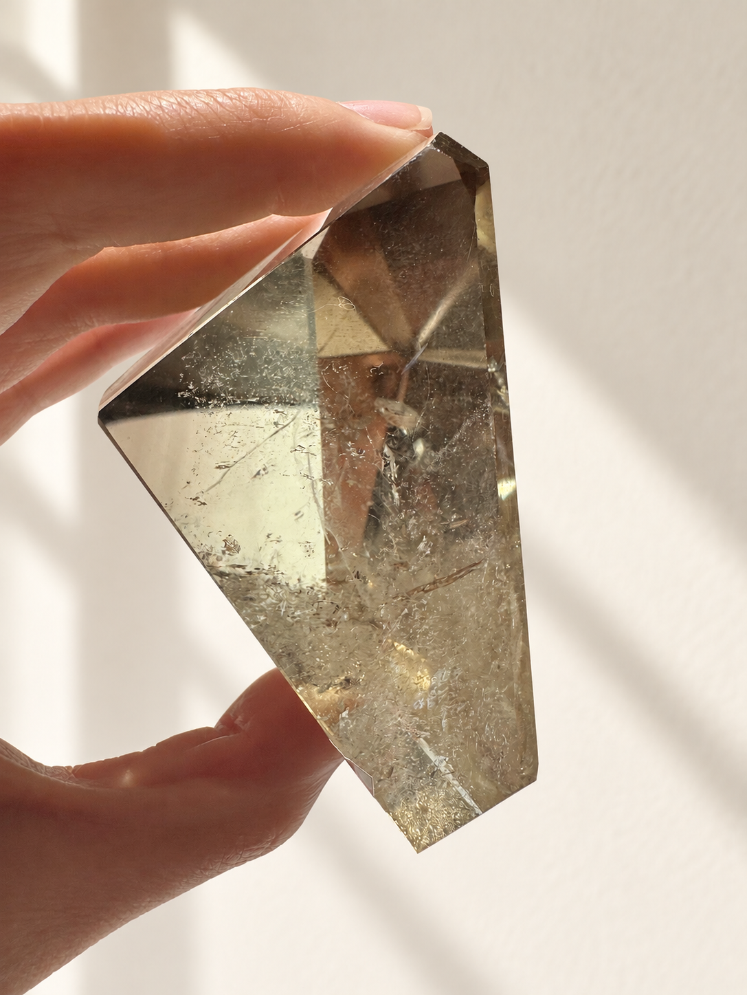 Natural Brazilian citrine 135g exact piece #6 view 3 in soft natural daylight against warm ivory wall