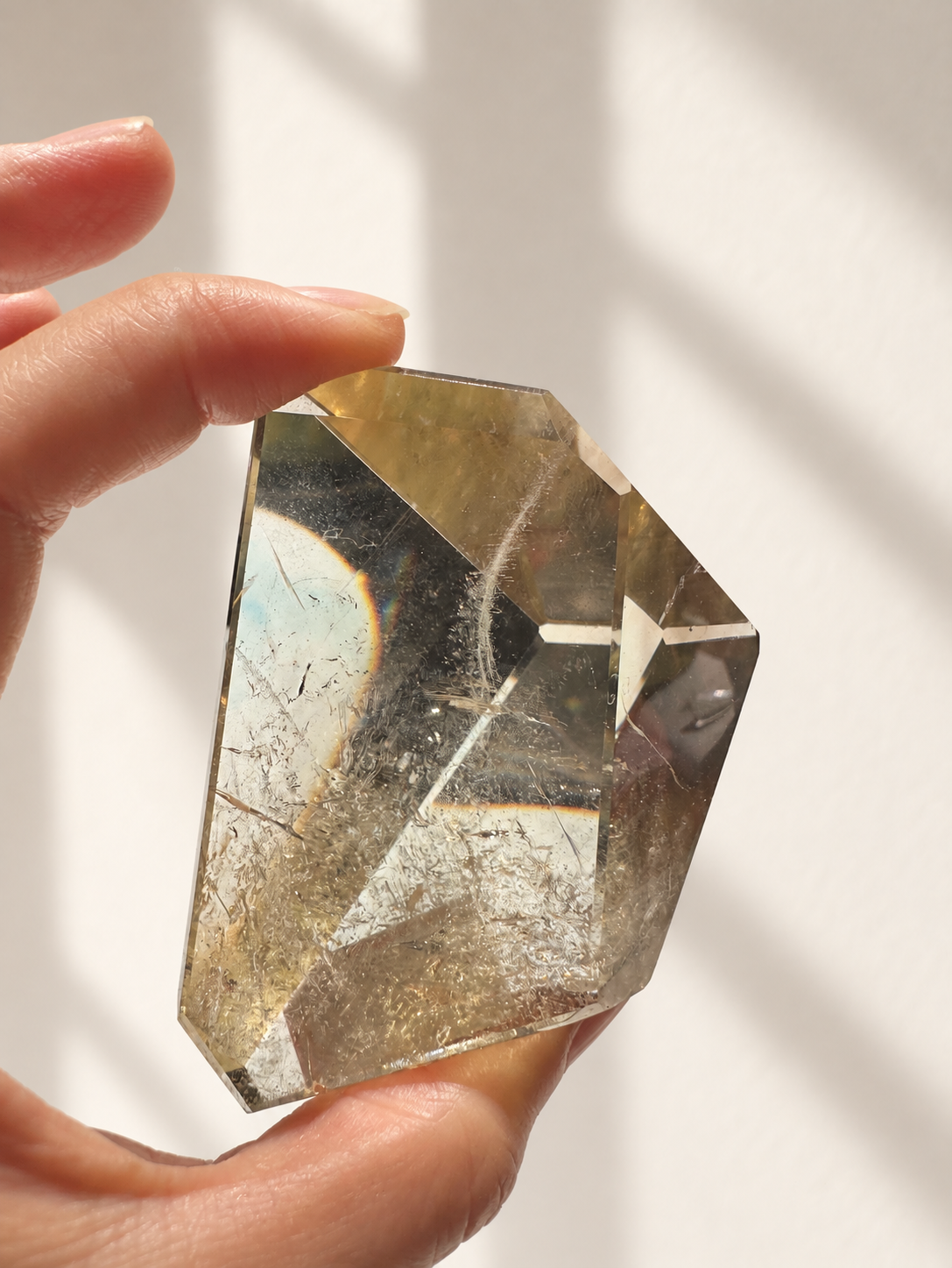 Natural Brazilian citrine 135g exact piece #6 view 5 in soft natural daylight against warm ivory wall