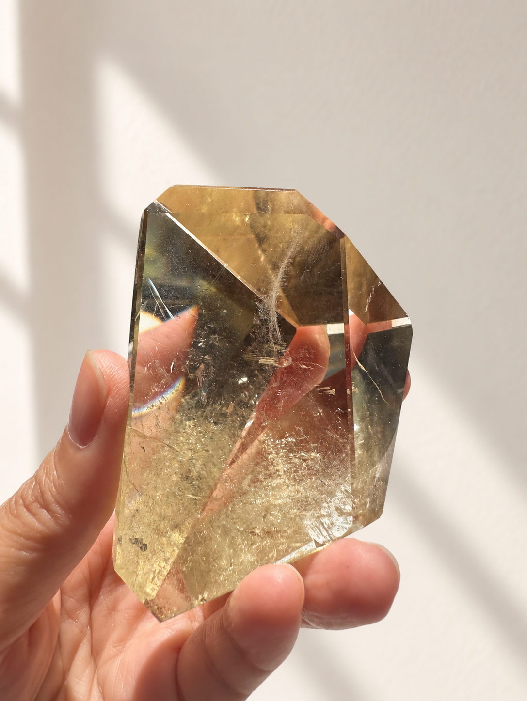 Natural Brazilian citrine 135g exact piece #6 view 9 in soft natural daylight against warm ivory wall