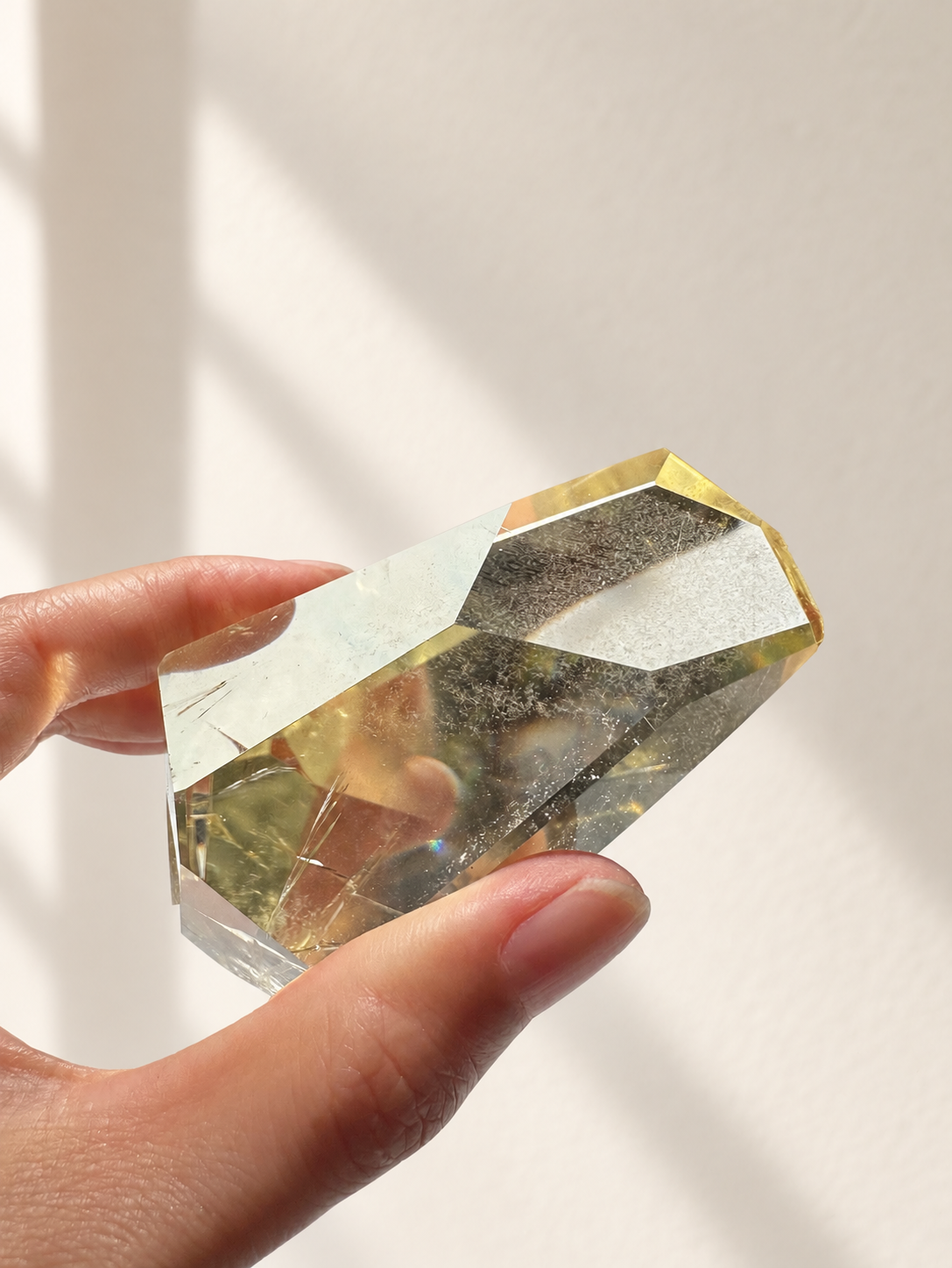 Natural Brazilian citrine 144g exact piece #11 view 12 in soft natural daylight against warm ivory wall