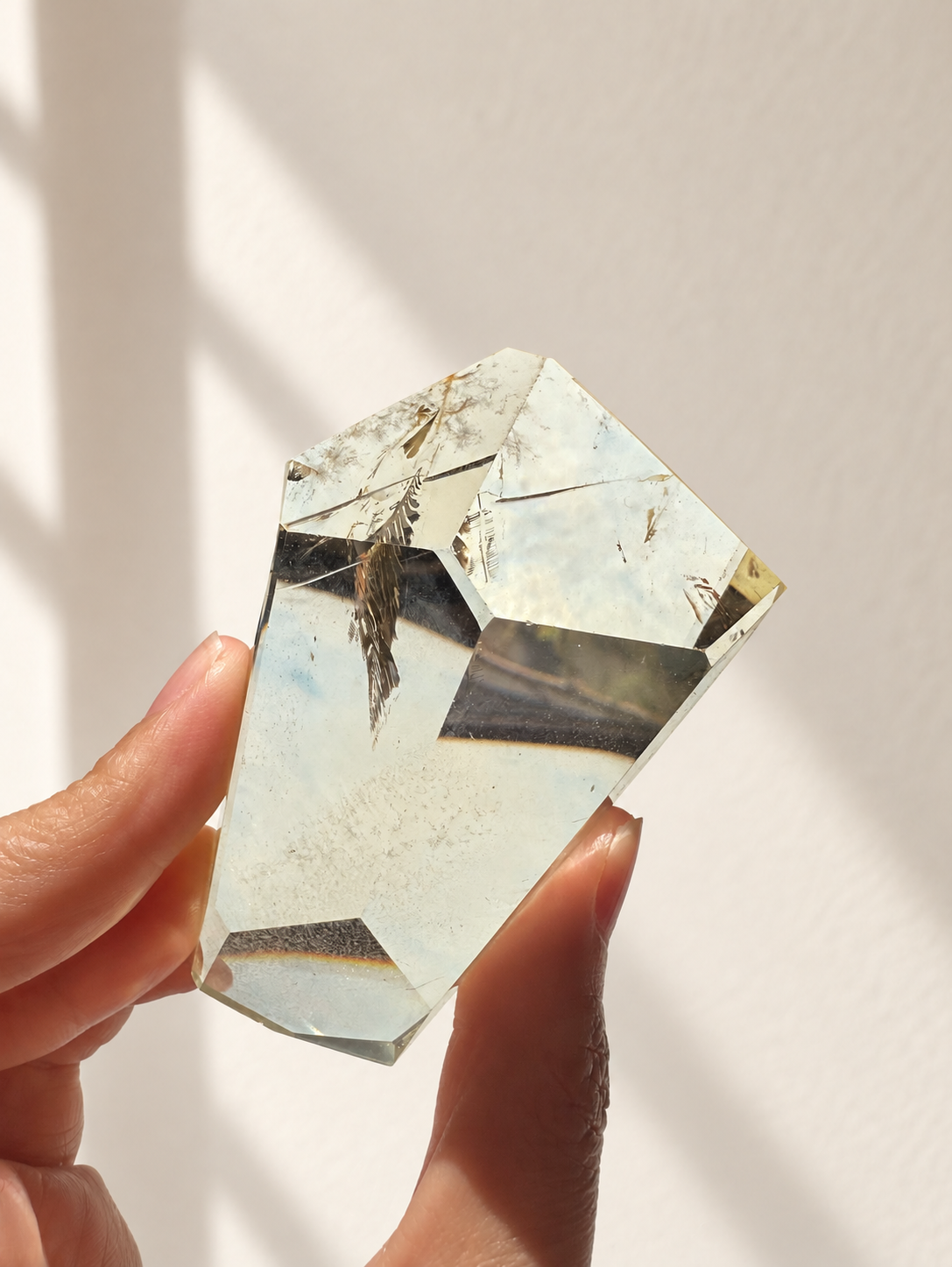 Natural Brazilian citrine 144g exact piece #11 view 4 in soft natural daylight against warm ivory wall