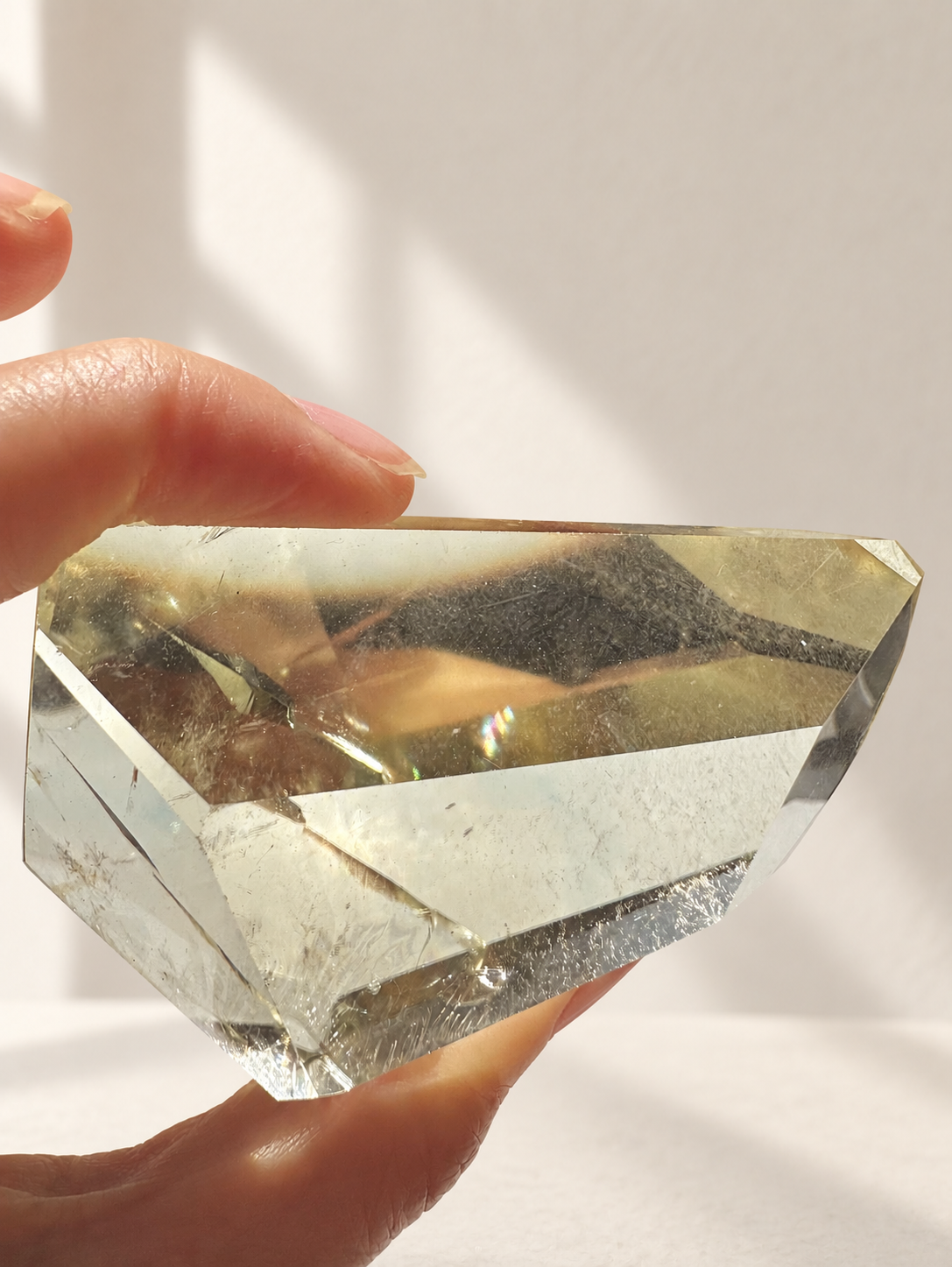 Natural Brazilian citrine 144g exact piece #11 view 6 in soft natural daylight against warm ivory wall