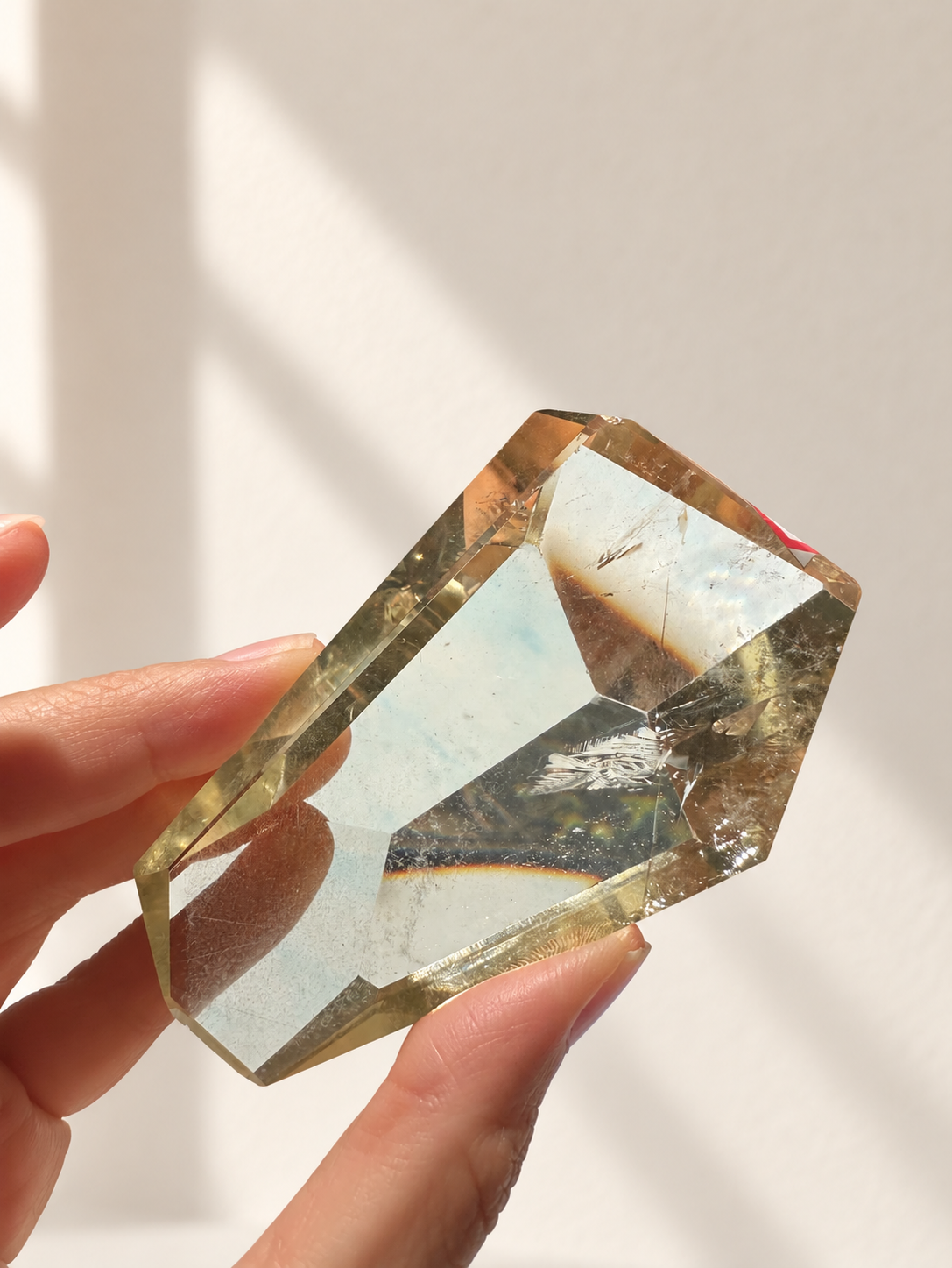Natural Brazilian citrine 144g exact piece #11 view 9 in soft natural daylight against warm ivory wall