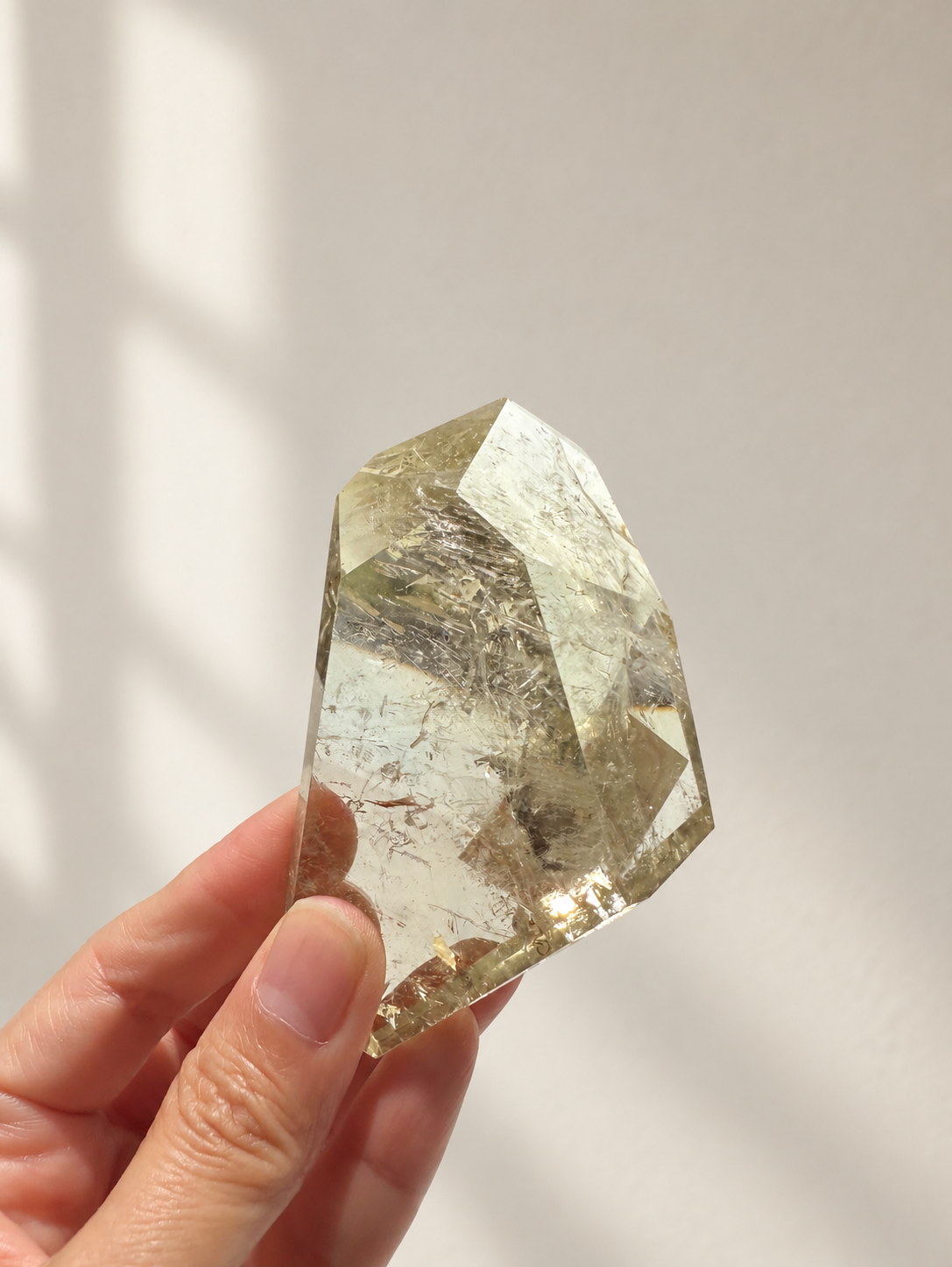 Exact citrine piece #5, 157g — main photo with soft indoor natural light and cream wall background
