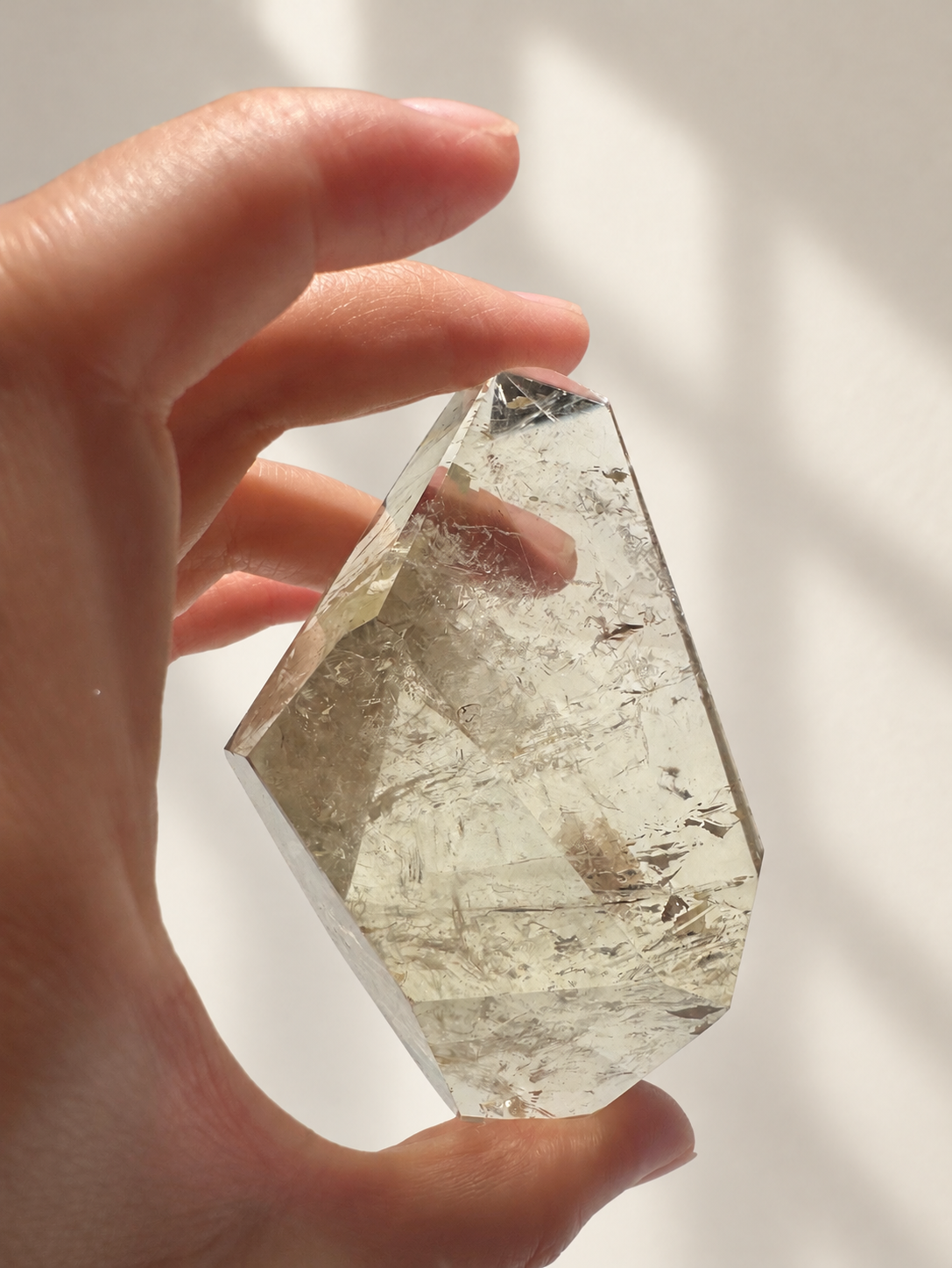 Natural Brazilian citrine 157g exact piece #5 view 4 in soft natural daylight against warm ivory wall