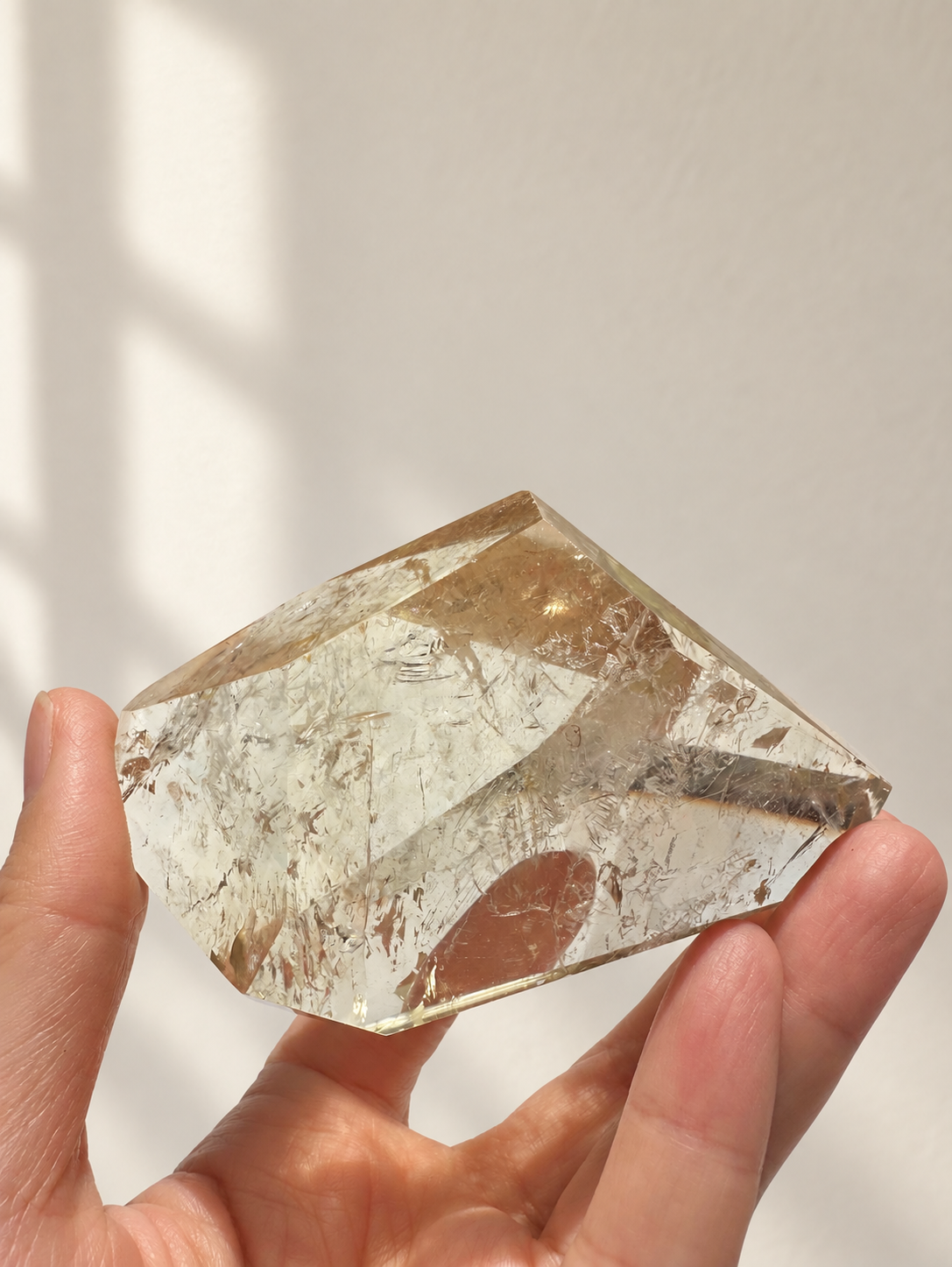 Natural Brazilian citrine 157g exact piece #5 view 5 in soft natural daylight against warm ivory wall