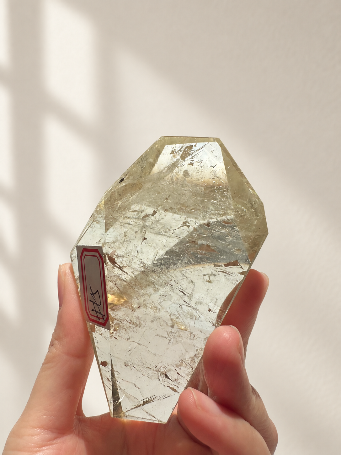 Natural Brazilian citrine 157g exact piece #5 view 7 in soft natural daylight against warm ivory wall