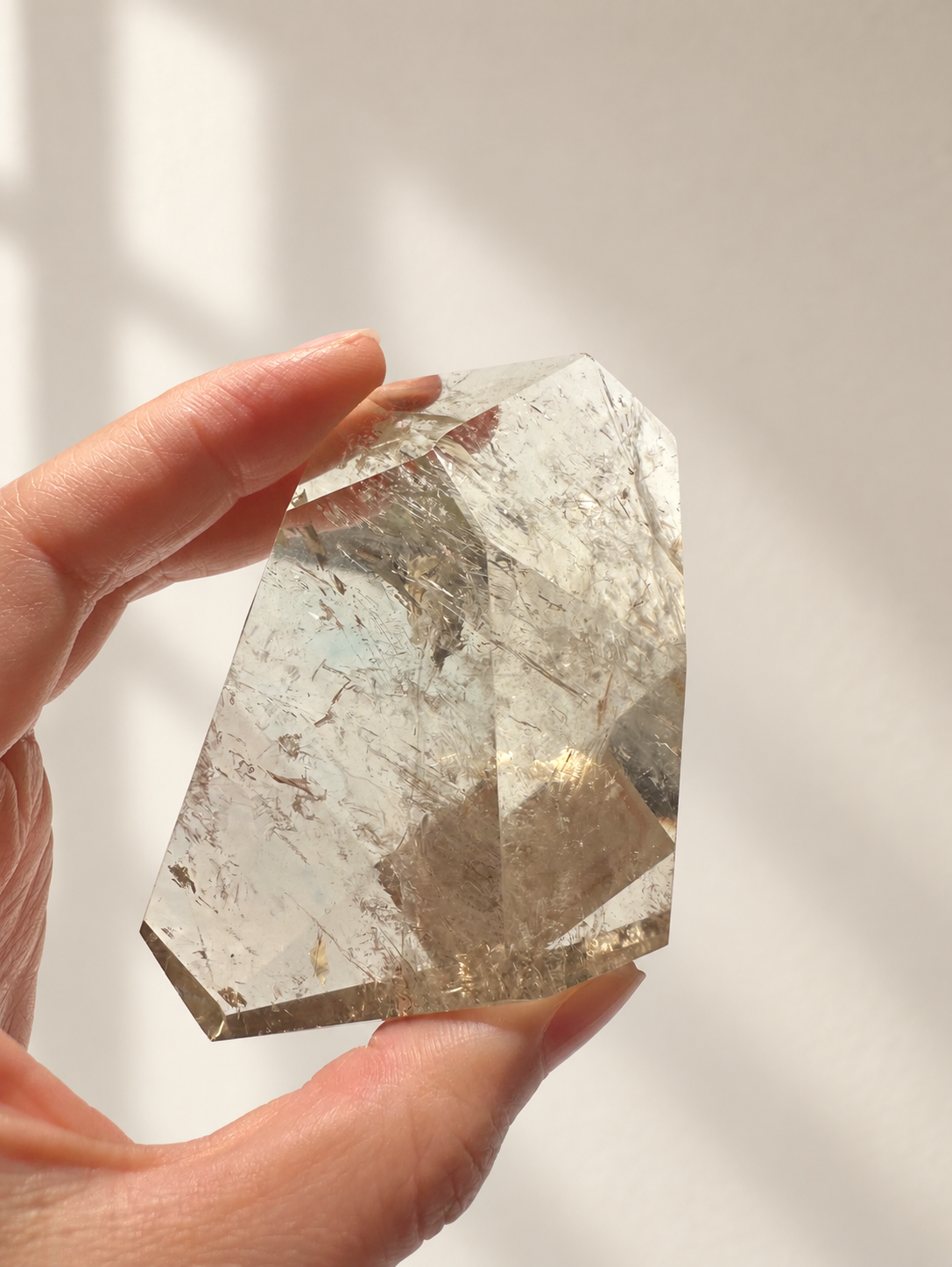 Natural Brazilian citrine 157g exact piece #5 view 8 in soft natural daylight against warm ivory wall