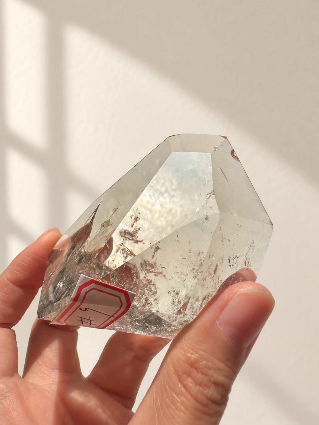 Natural Brazilian citrine 164g exact piece #9 view 2 in soft natural daylight against warm ivory wall