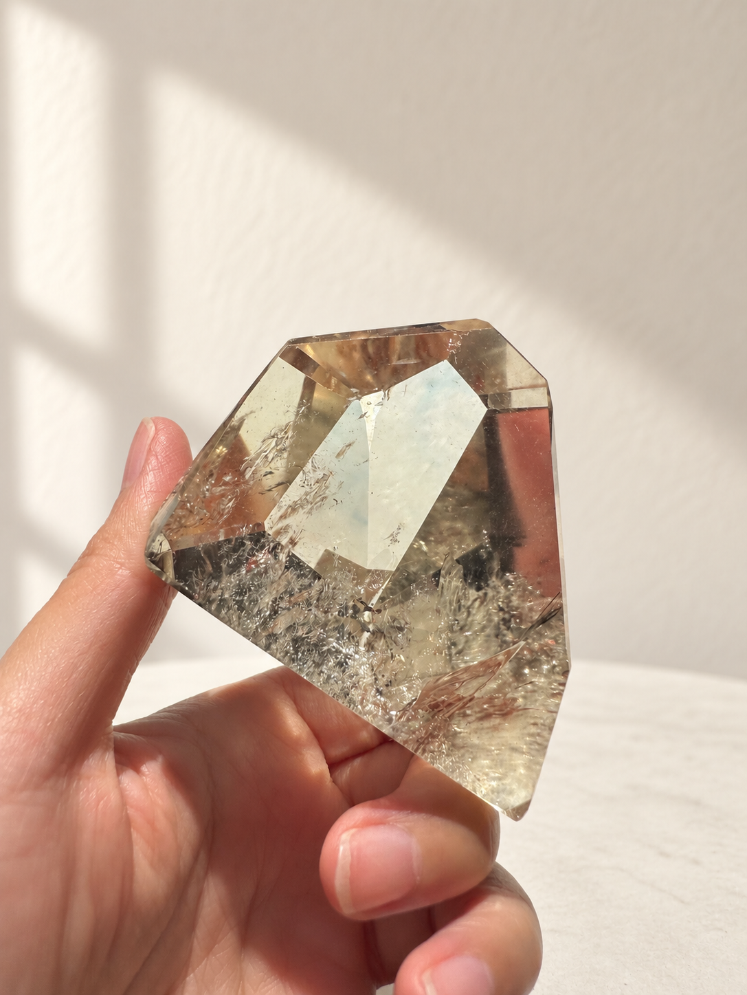 Natural Brazilian citrine 164g exact piece #9 view 5 in soft natural daylight against warm ivory wall