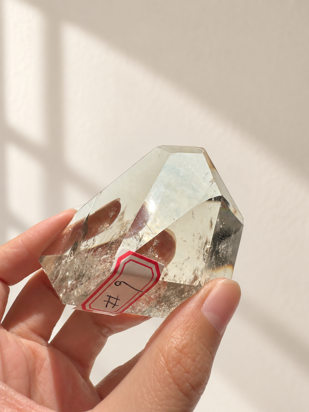 Natural Brazilian citrine 164g exact piece #9 view 8 in soft natural daylight against warm ivory wall