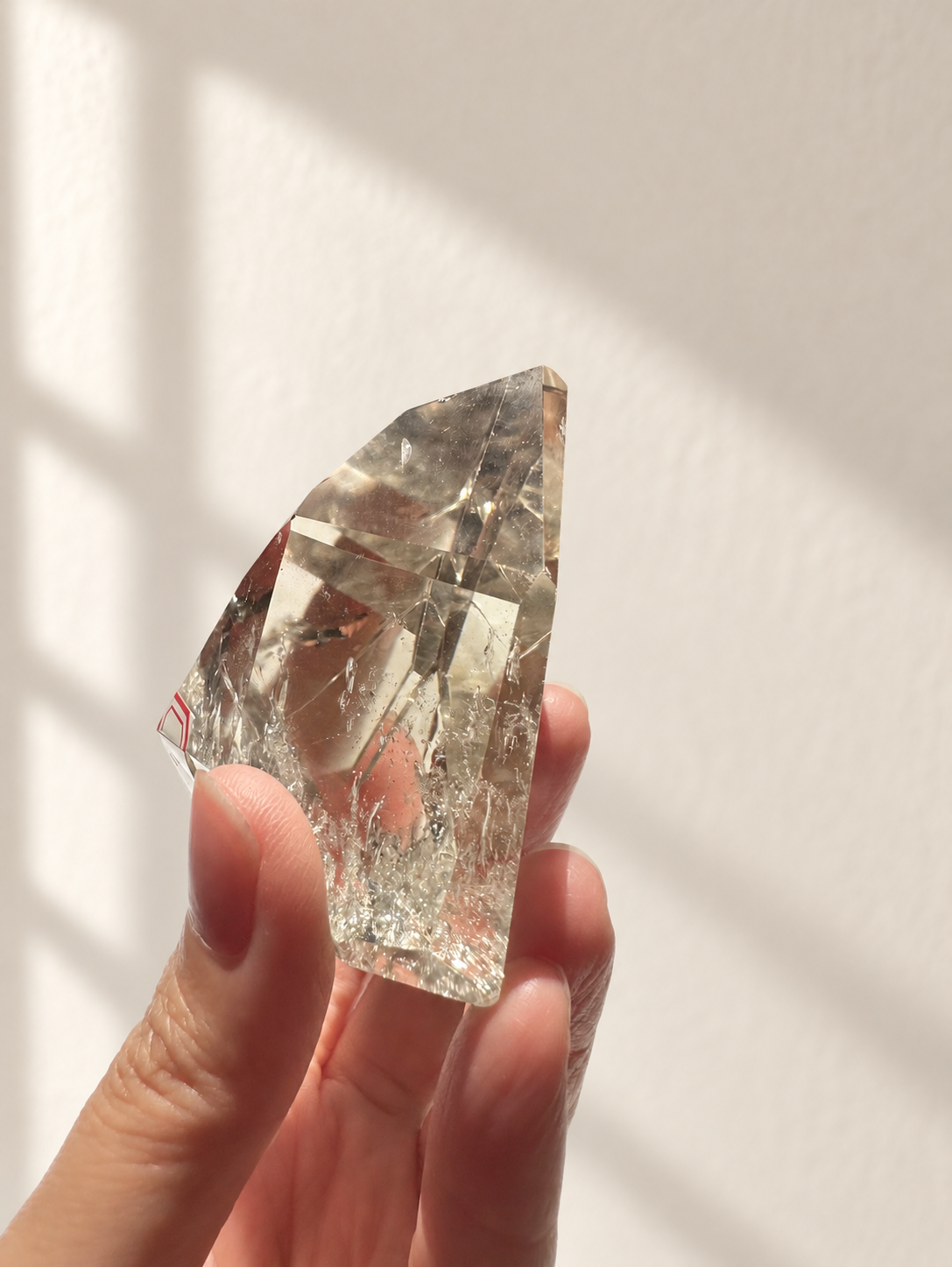 Natural Brazilian citrine 164g exact piece #9 view 9 in soft natural daylight against warm ivory wall