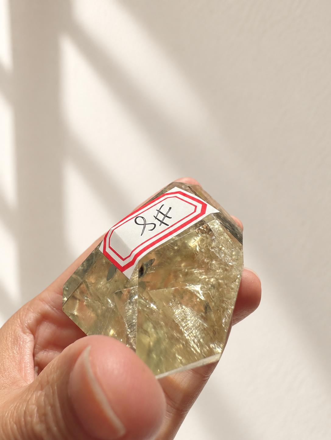 Natural Brazilian citrine 78g exact piece #8 view 11 in soft natural daylight against warm ivory wall