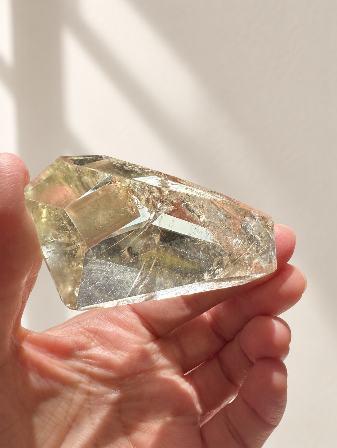 Natural Brazilian citrine 78g exact piece #8 view 12 in soft natural daylight against warm ivory wall