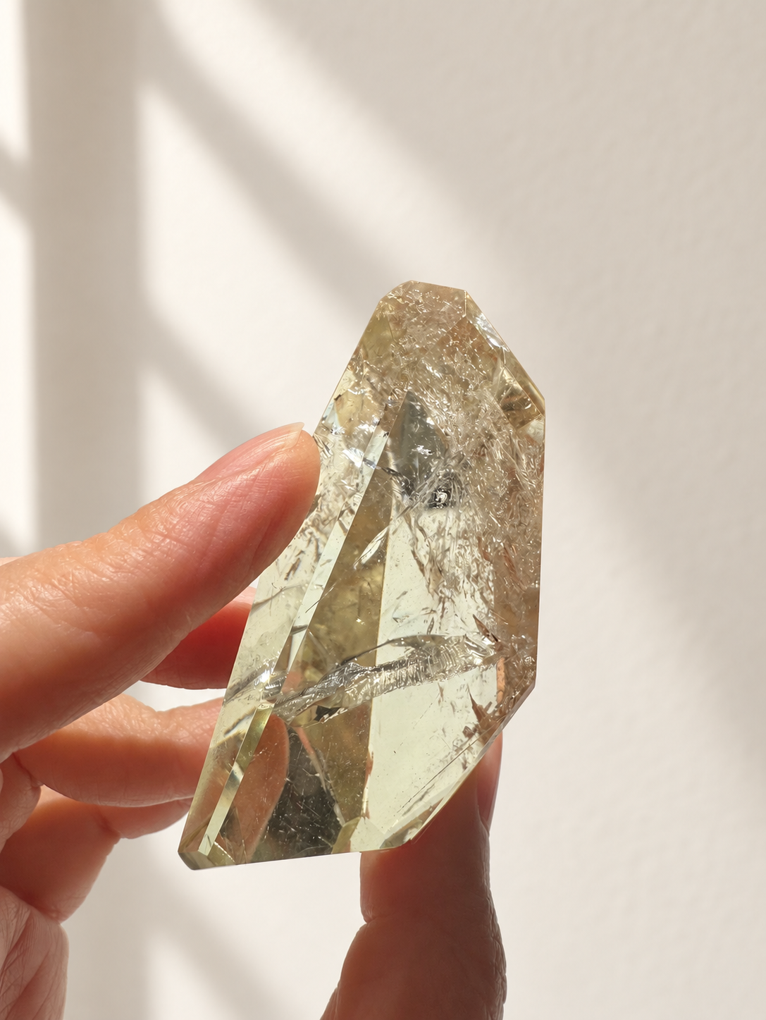 Natural Brazilian citrine 78g exact piece #8 view 16 in soft natural daylight against warm ivory wall