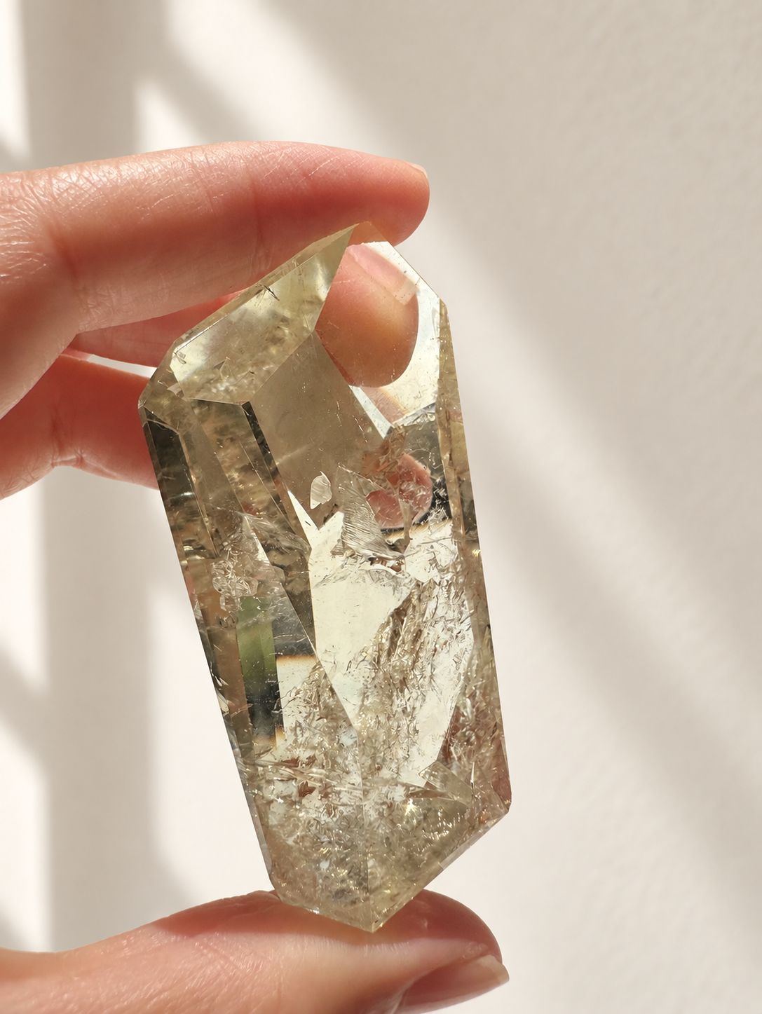 Natural Brazilian citrine 78g exact piece #8 view 4 in soft natural daylight against warm ivory wall