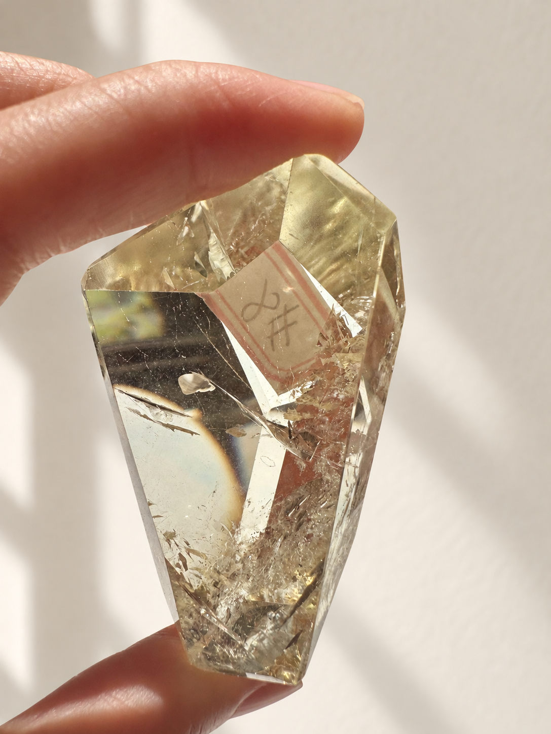Natural Brazilian citrine 78g exact piece #8 view 5 in soft natural daylight against warm ivory wall