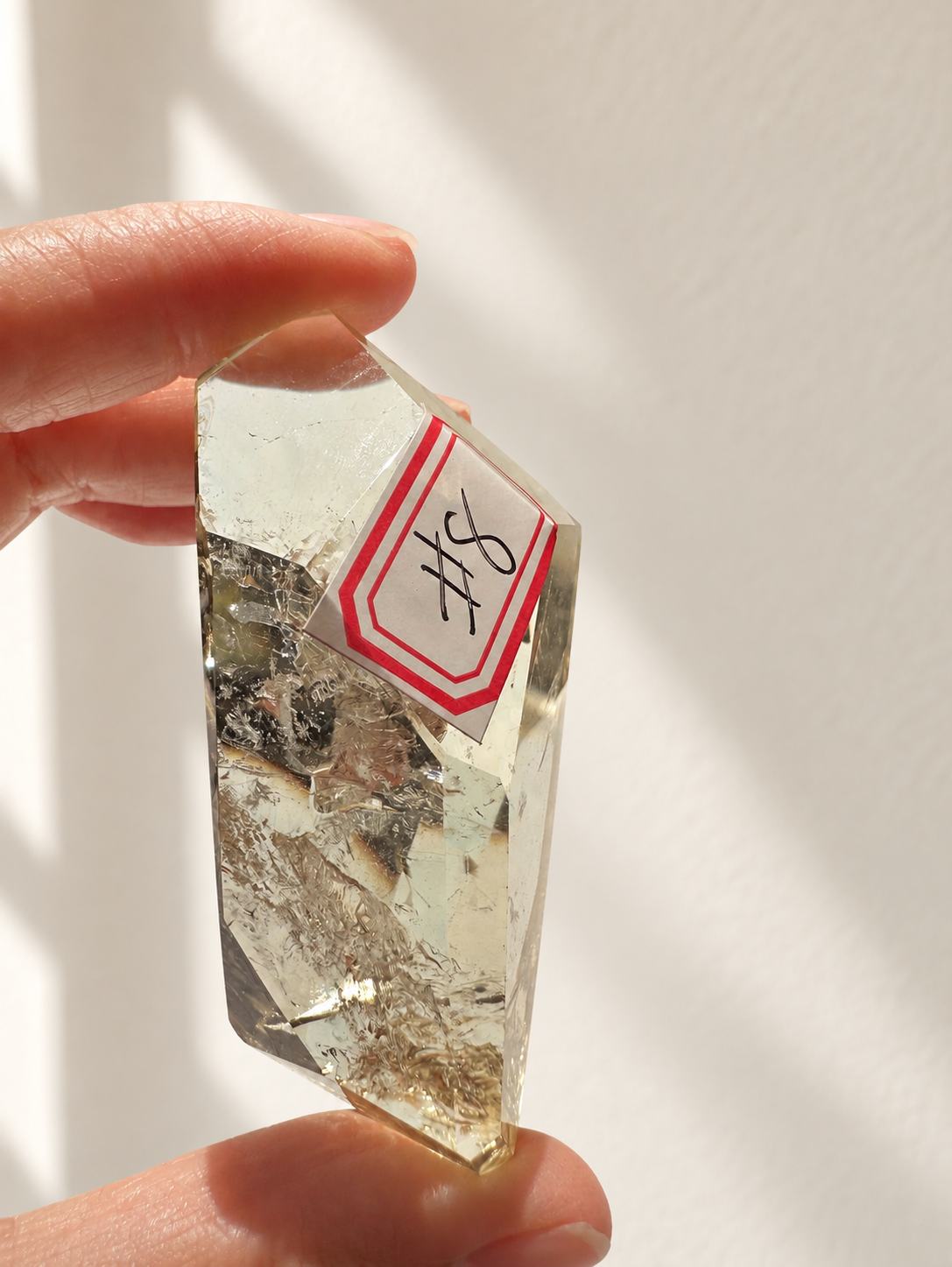Natural Brazilian citrine 78g exact piece #8 view 8 in soft natural daylight against warm ivory wall
