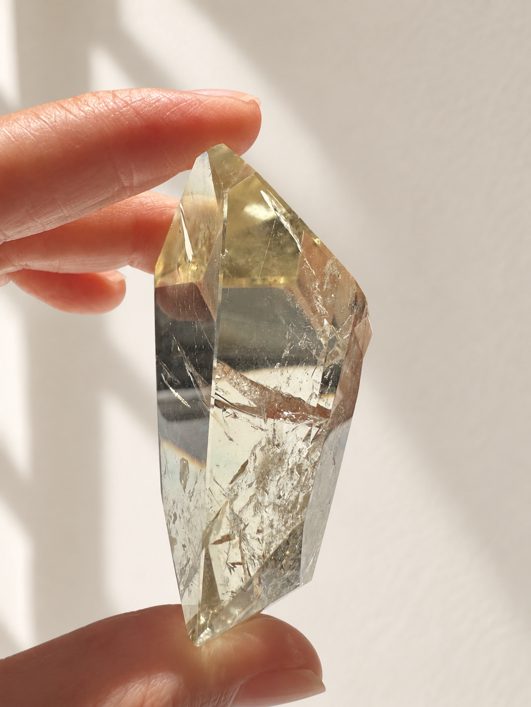 Natural Brazilian citrine 78g exact piece #8 view 9 in soft natural daylight against warm ivory wall