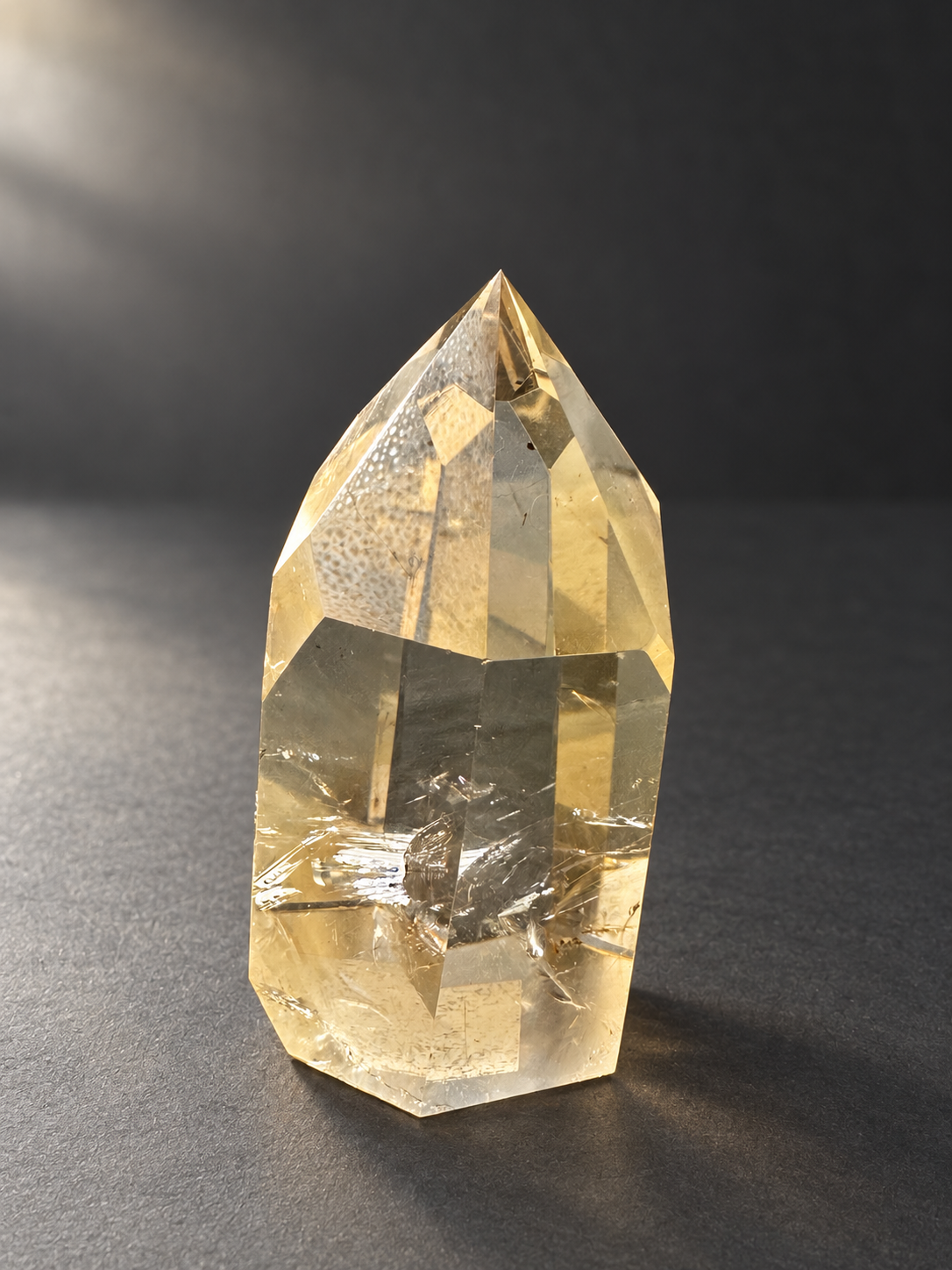Natural unheated Congo citrine point No.12, 194g, soft side daylight — angle 3