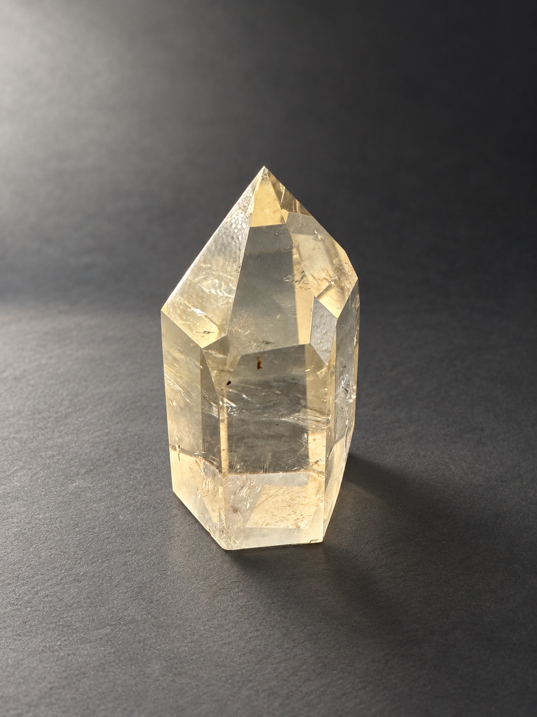 Natural unheated Congo citrine point No.12, 194g, soft side daylight — angle 6