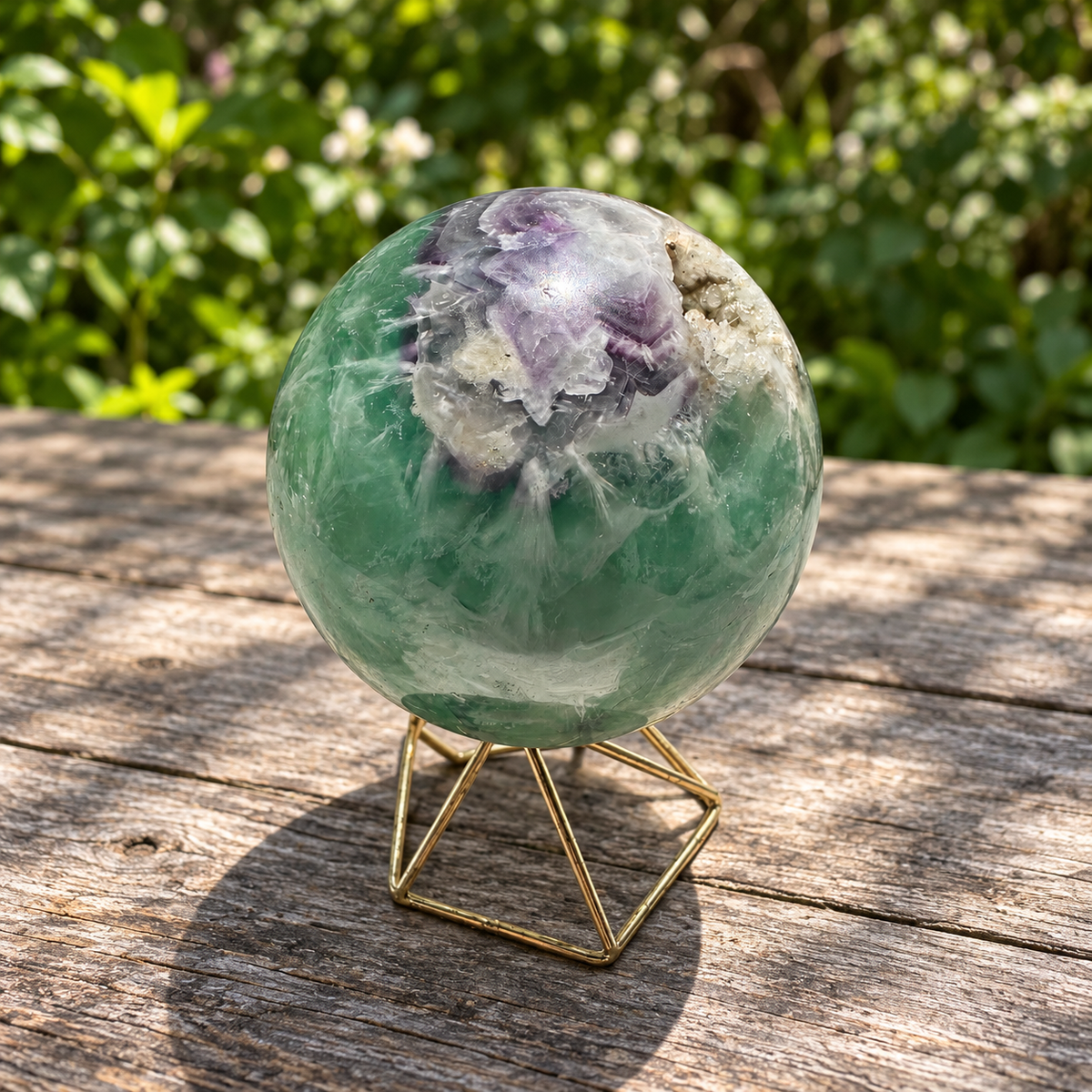 Purple colour zone beside the rough crystal cavity on Madagascar feather fluorite sphere No.4