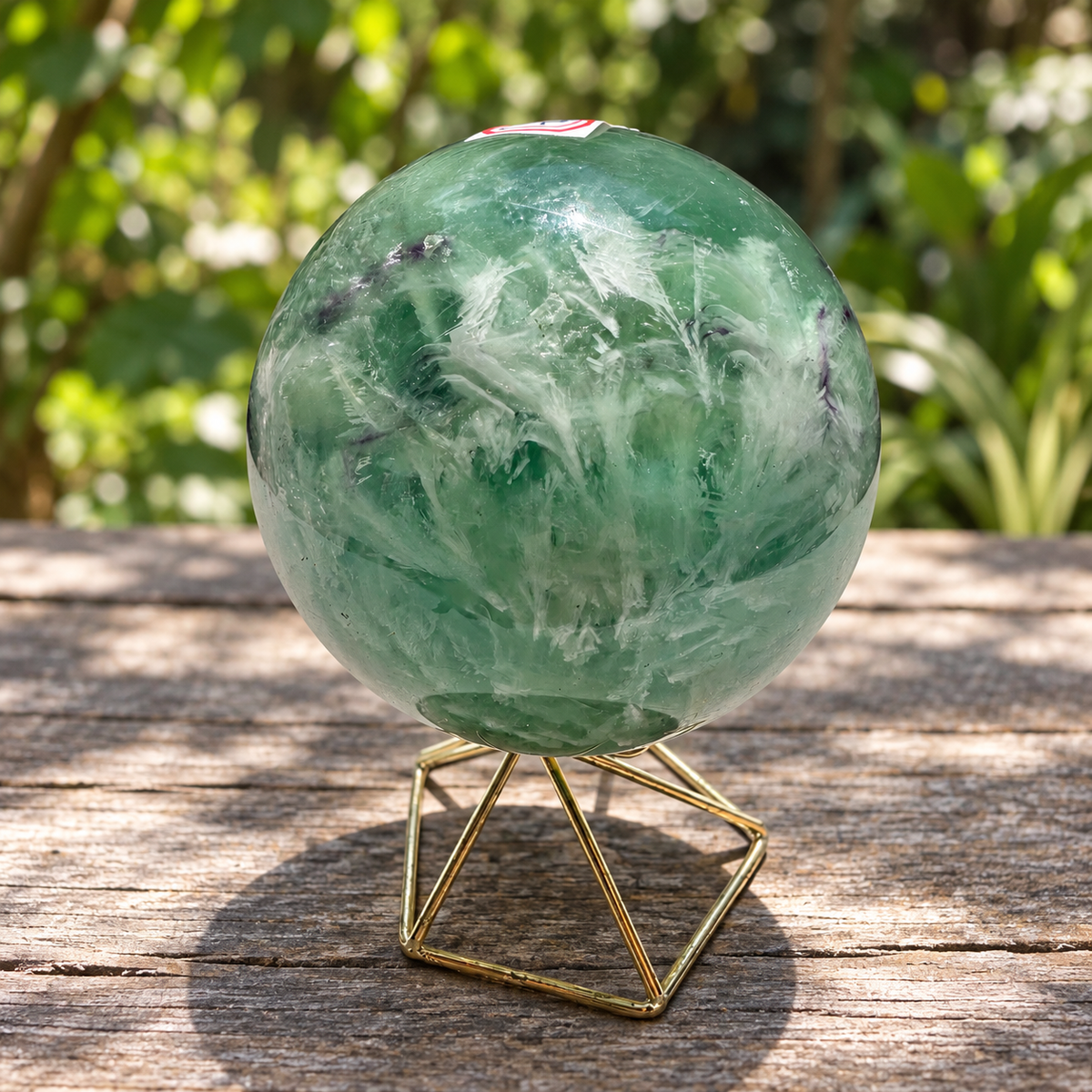 Reverse side of exact feather fluorite sphere No.4 showing green zones, white plumes and natural internal lines