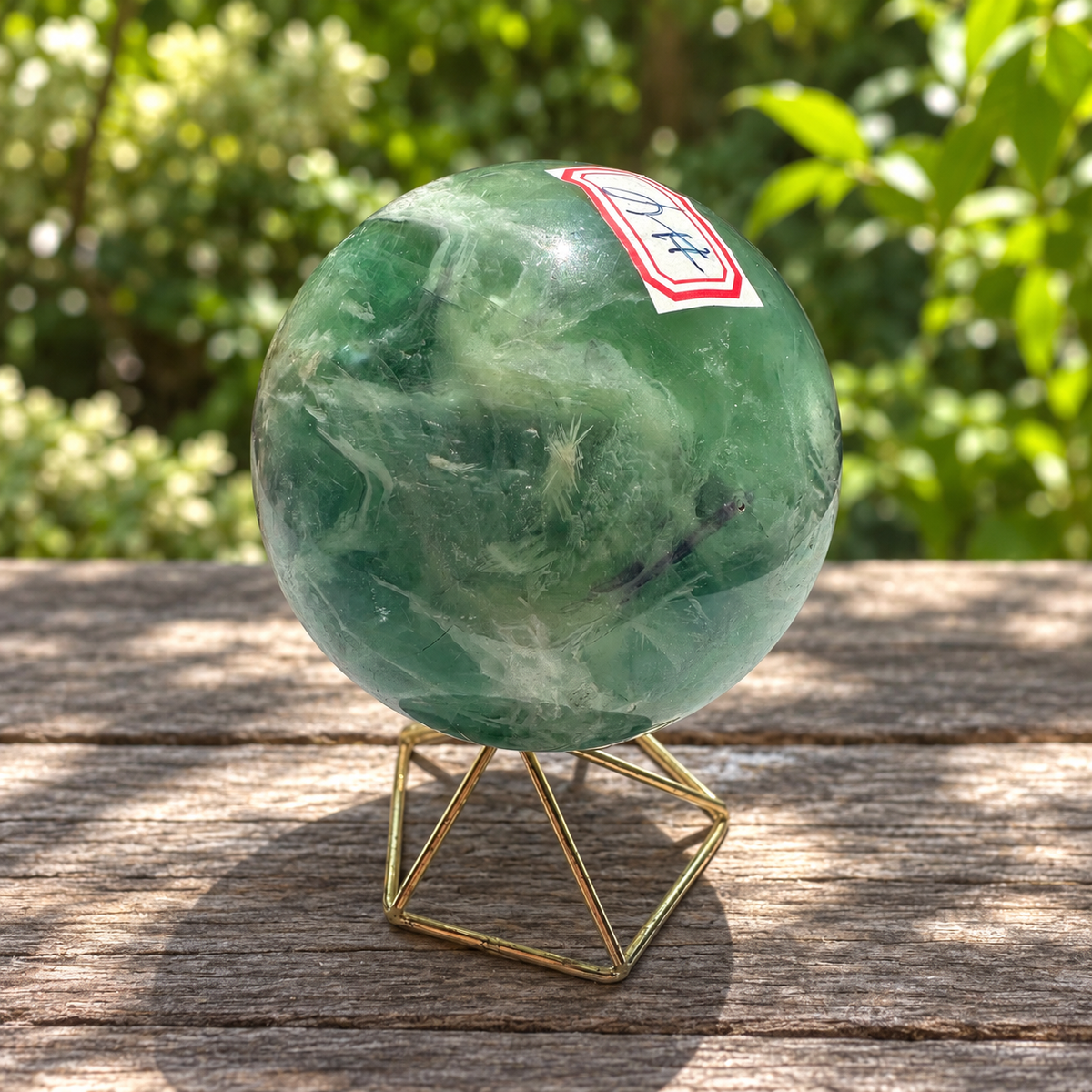 Alternate labelled view of exact green feather fluorite sphere No.4 showing white inclusions and purple banding