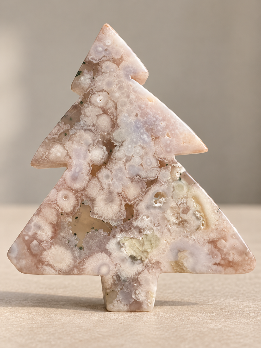 Flower Agate Christmas tree carving with natural blossom inclusions, front view