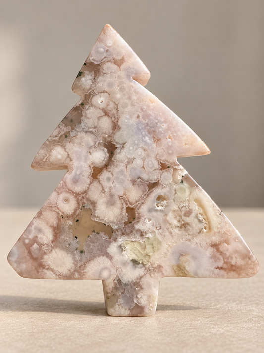 Flower Agate Christmas tree carving with natural blossom inclusions, front view