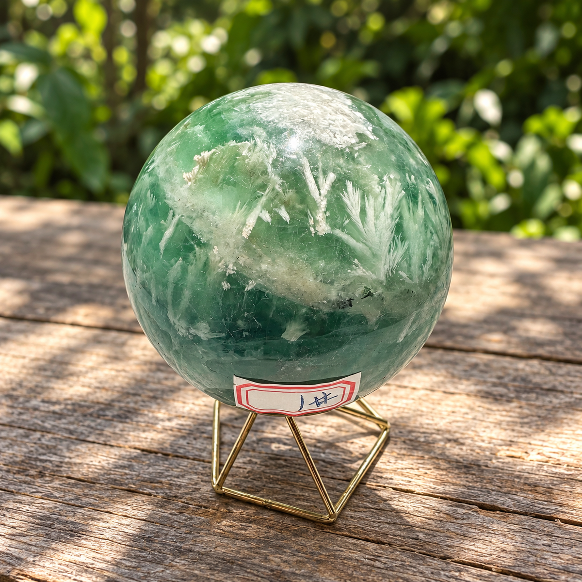 Alternate view of 78mm feather fluorite sphere with white plumes and red No.1 label