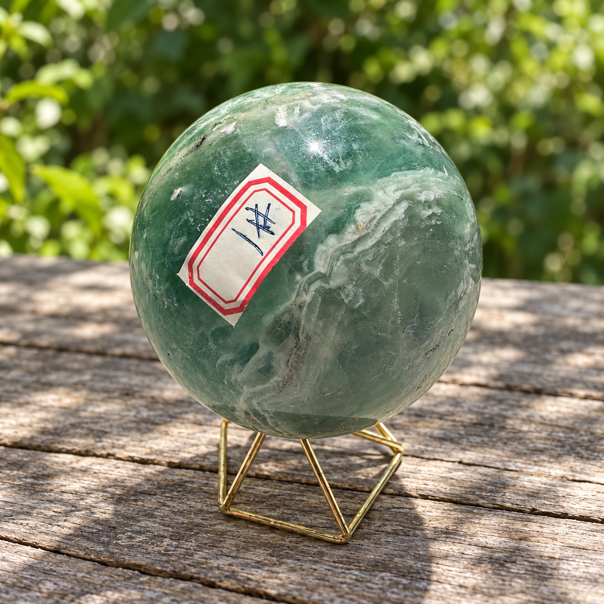 Supplementary reverse view of exact feather fluorite sphere No.1 showing its red identification label, green zone and layered pale band