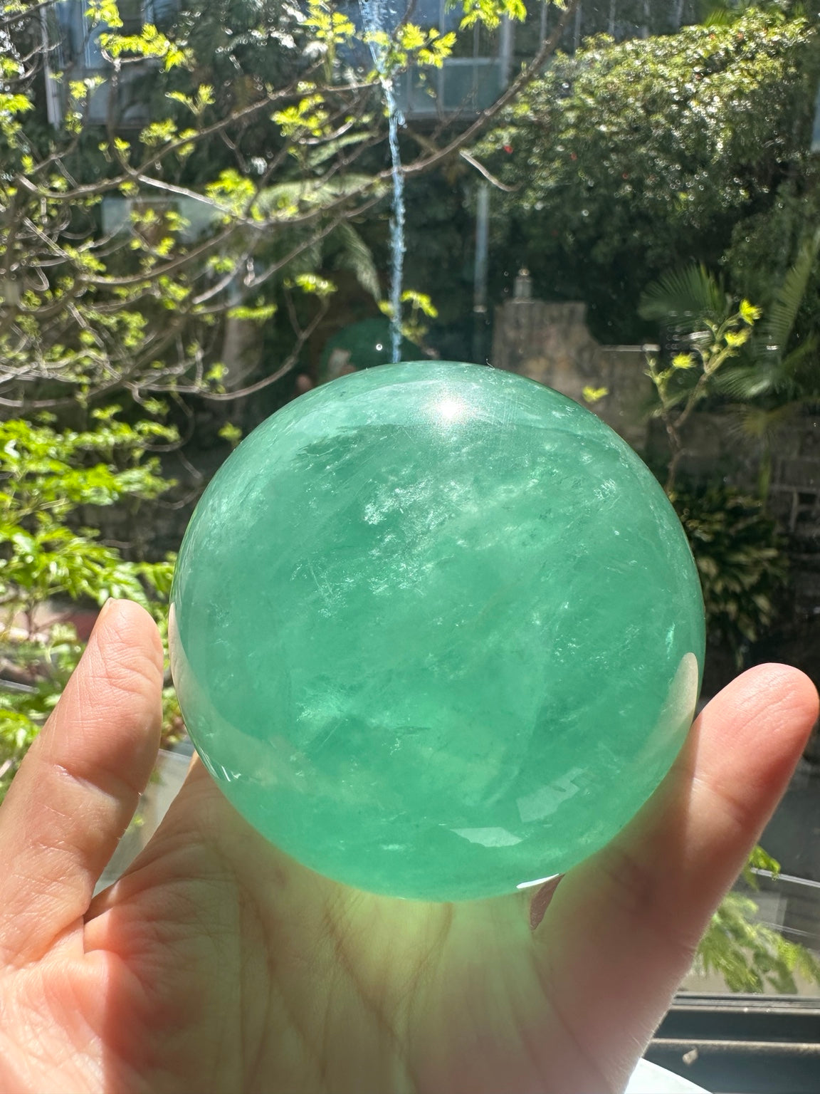 Unedited natural-light original of Madagascar green fluorite sphere #3 725g, view 2