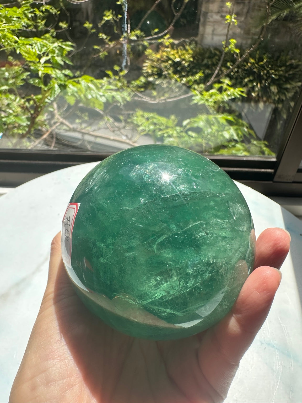 Unedited natural-light original of Madagascar green fluorite sphere #4 925g, view 1