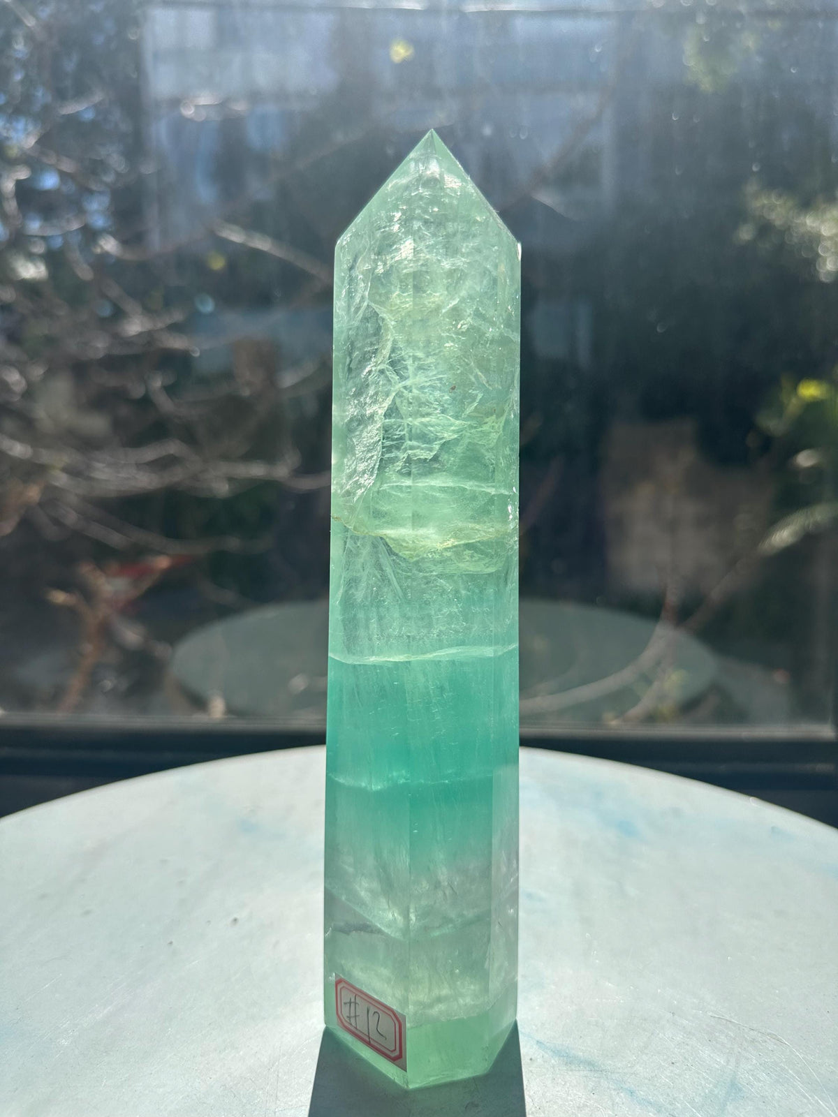 Side view of exact 700g 20cm green Rainbow Fluorite tower #12