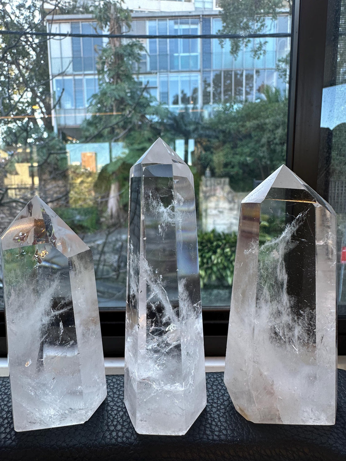 Natural Clear Quartz tower showing internal veils and reflections