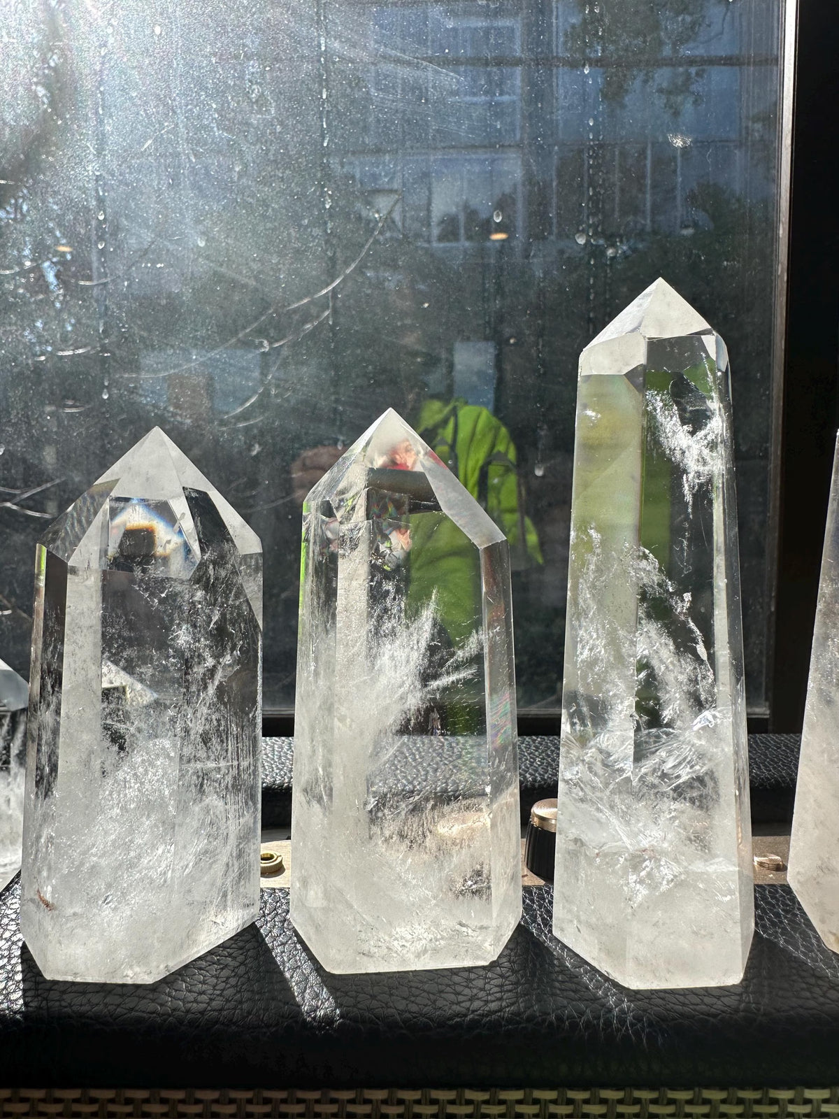 Polished Clear Quartz crystal point photographed in natural light