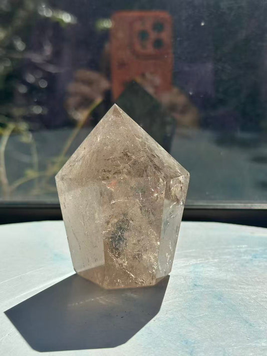 Premium light champagne smoky quartz tower with vibrant internal rainbows, a signature Moon Rituals specimen.