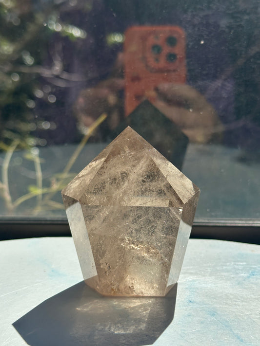 Premium light champagne smoky quartz tower with vibrant internal rainbows, a signature Moon Rituals specimen.
