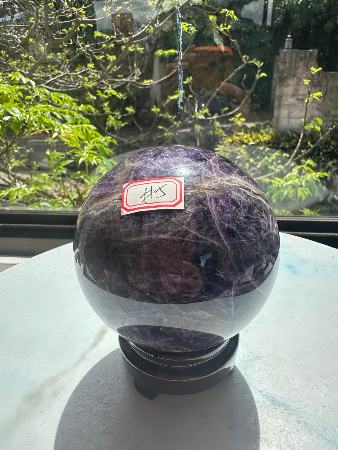 Original natural-light photograph of Dream Amethyst sphere #5, numbered view