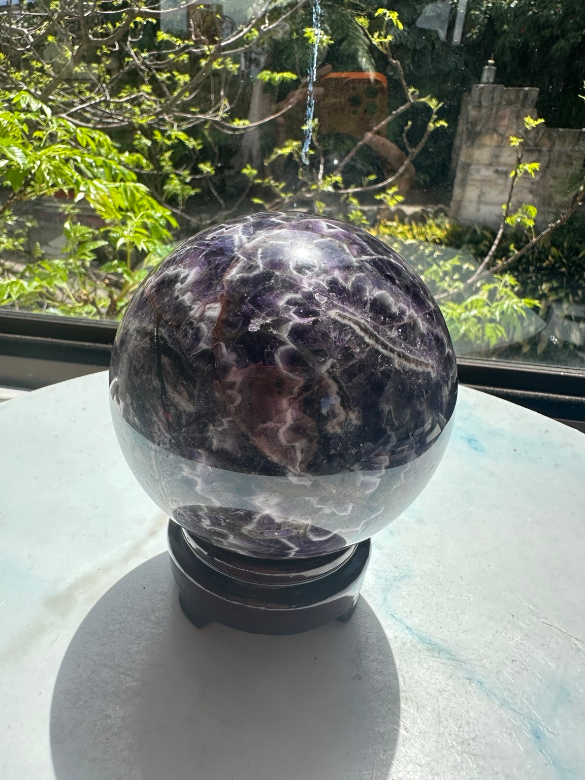 Original natural-light view of Dream Amethyst sphere #6 with stand