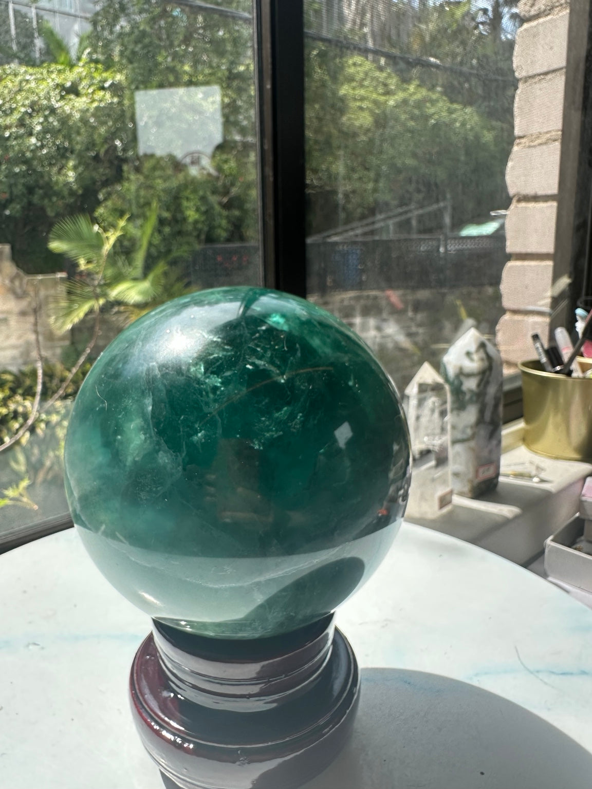Madagascar fluorite sphere from alternate side with green zoning and stand