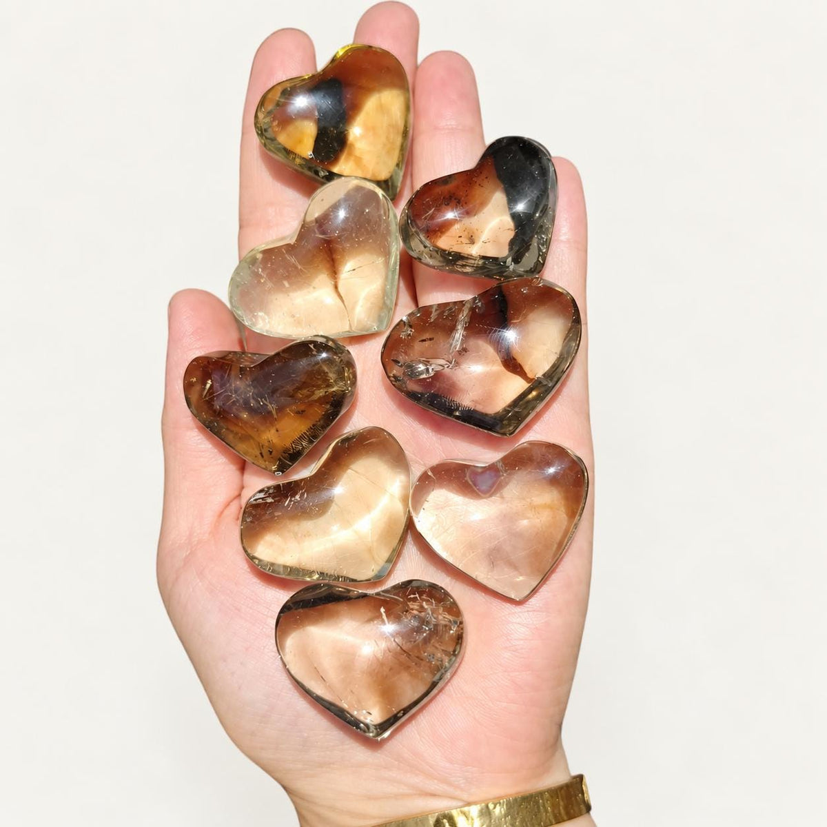 Golden citrine heart in soft indoor light.