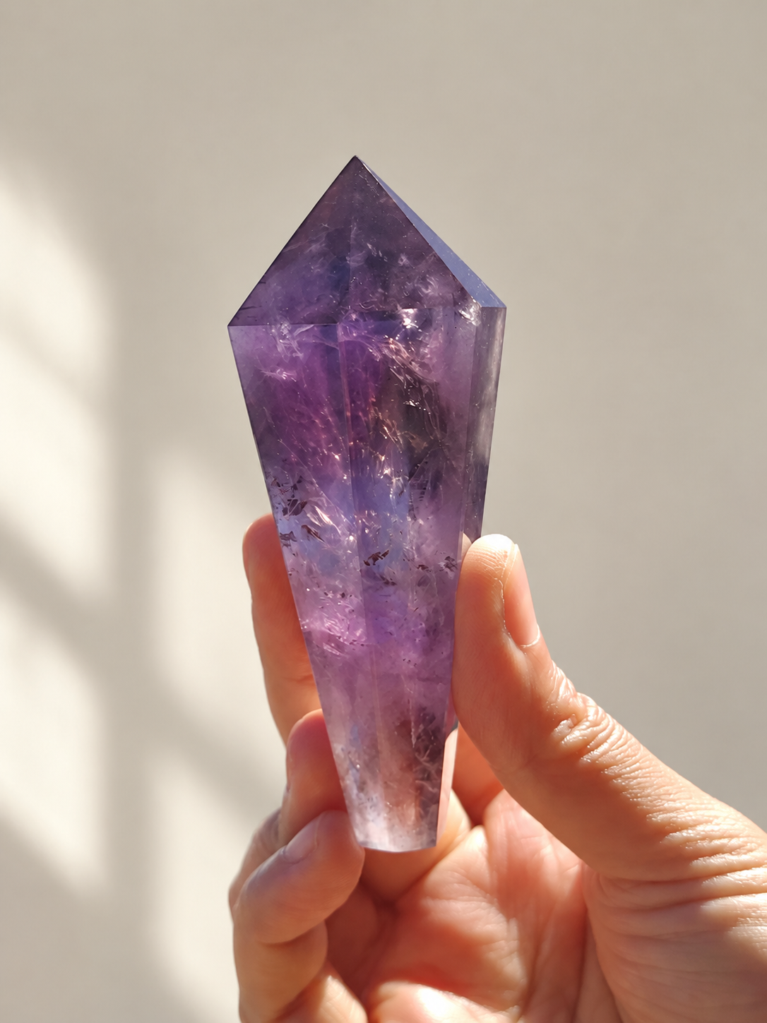 Brazilian Amethyst Wand, detailed view 3 in soft indoor light.