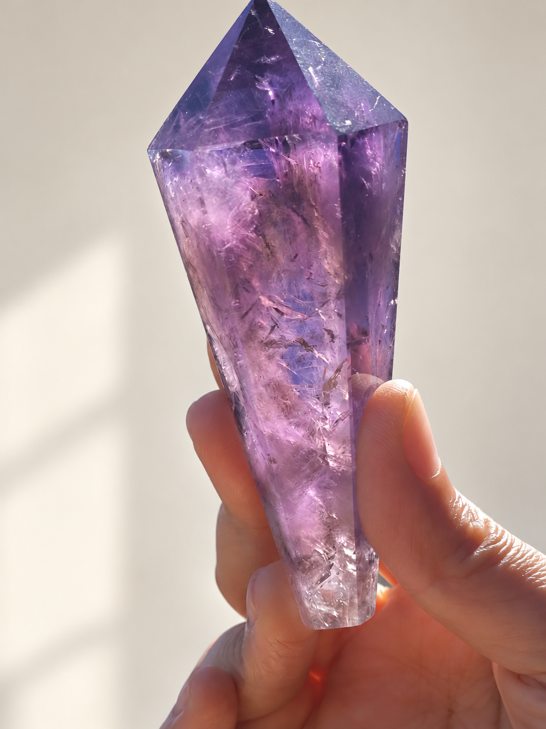 Brazilian Amethyst Wand, detailed view 7 in soft indoor light.