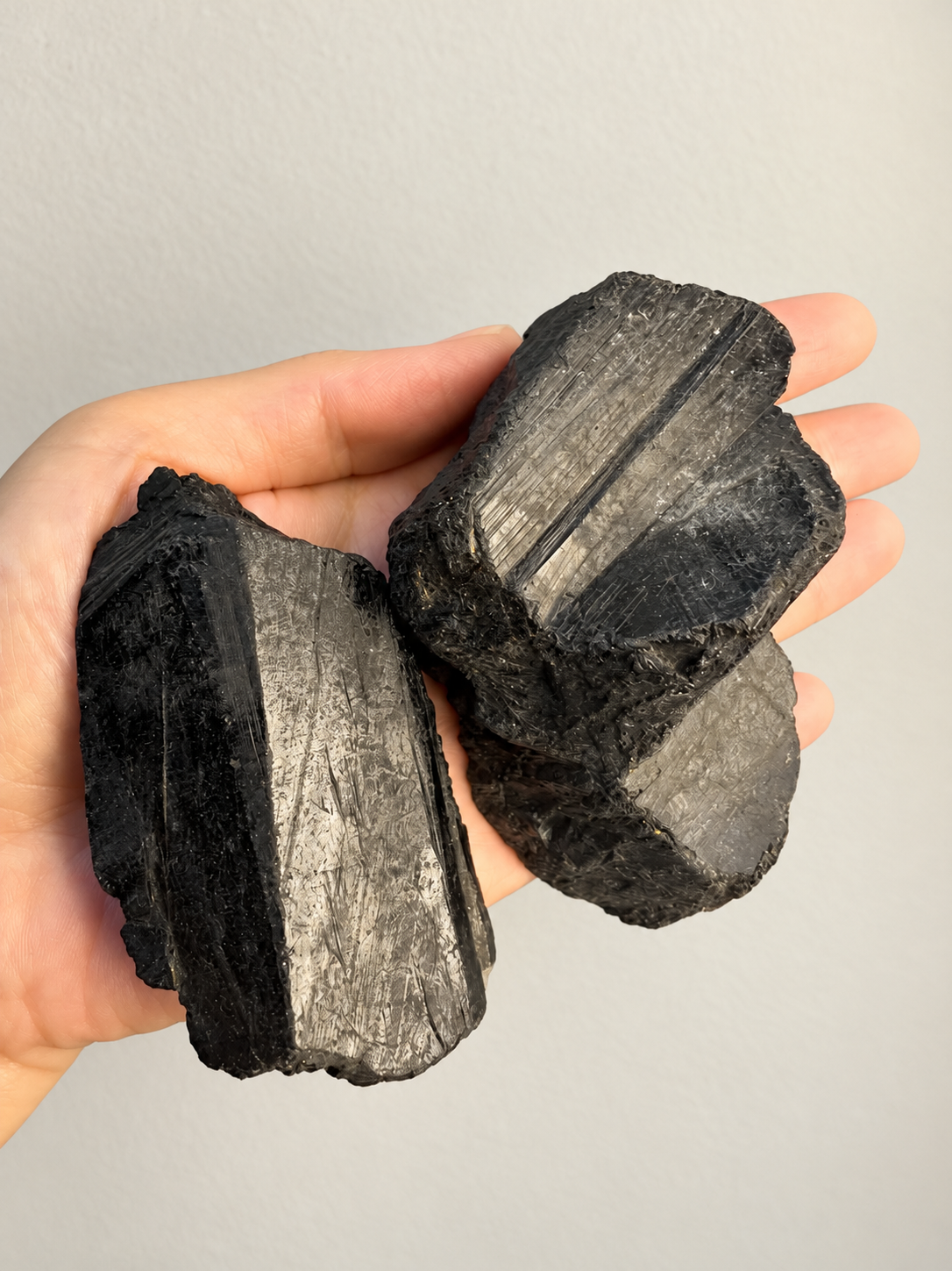Large Raw Black Tourmaline Chunk, detailed view 5 in soft indoor light.