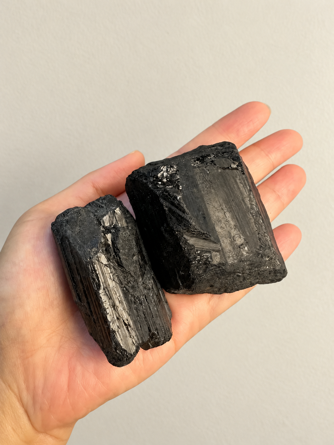 Large Raw Black Tourmaline Chunk, detailed view 6 in soft indoor light.