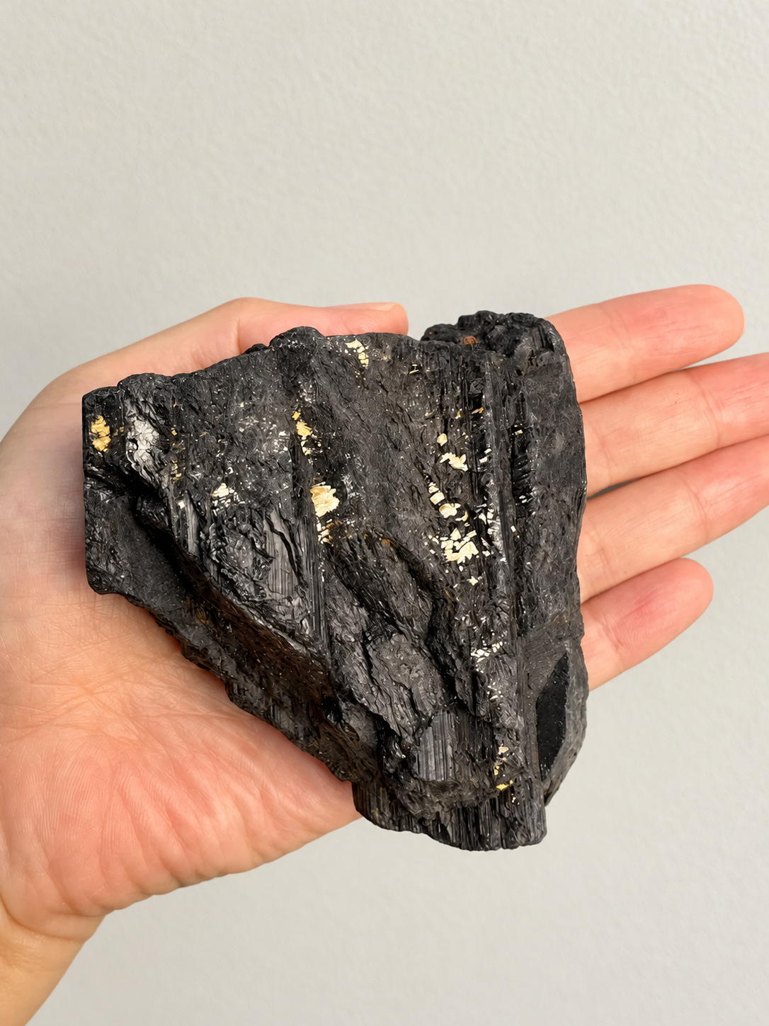 Large Raw Black Tourmaline Chunk, detailed view 8 in soft indoor light.