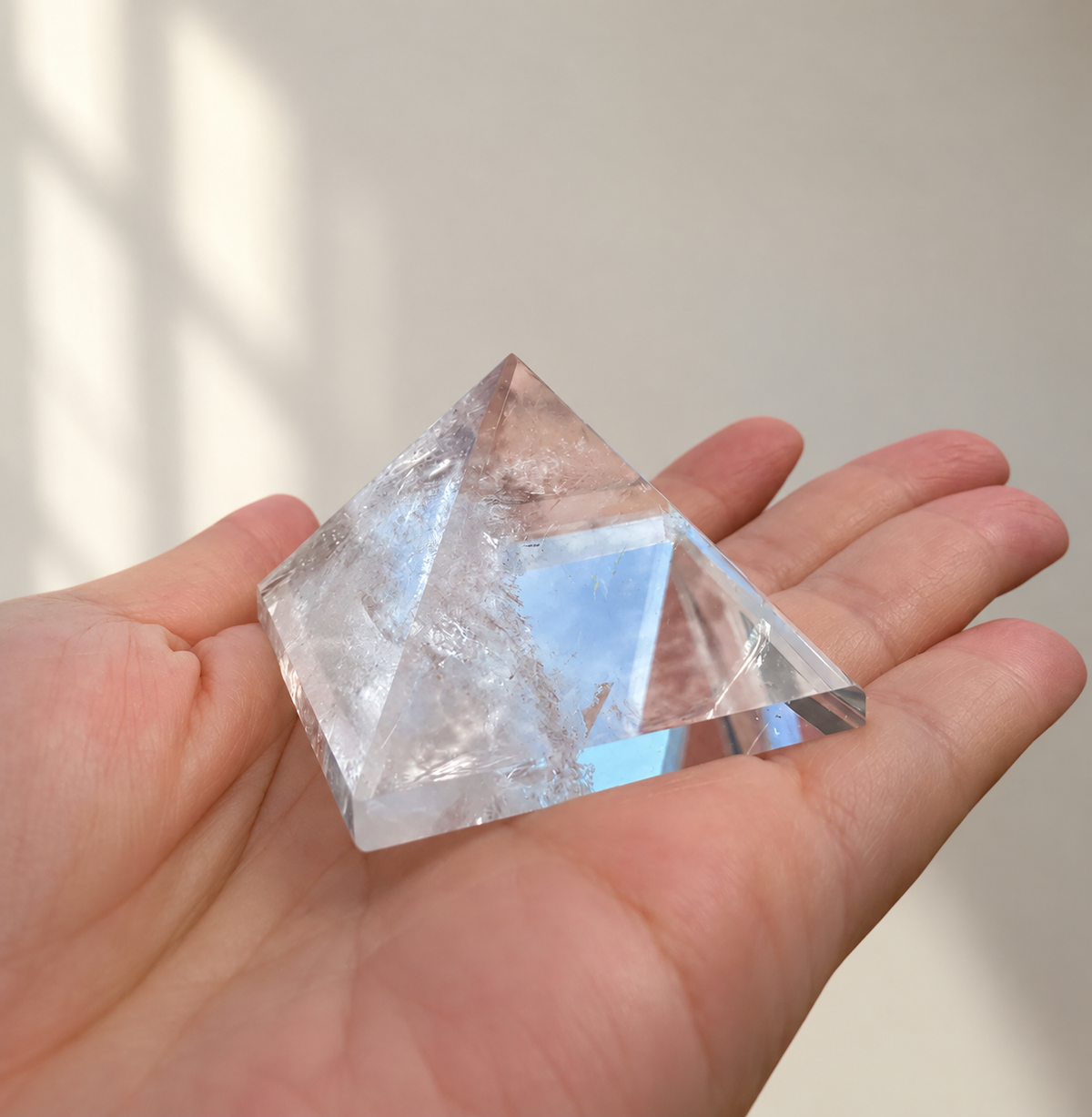 Natural Clear Quartz Pyramid, detailed view 2 in soft indoor light.