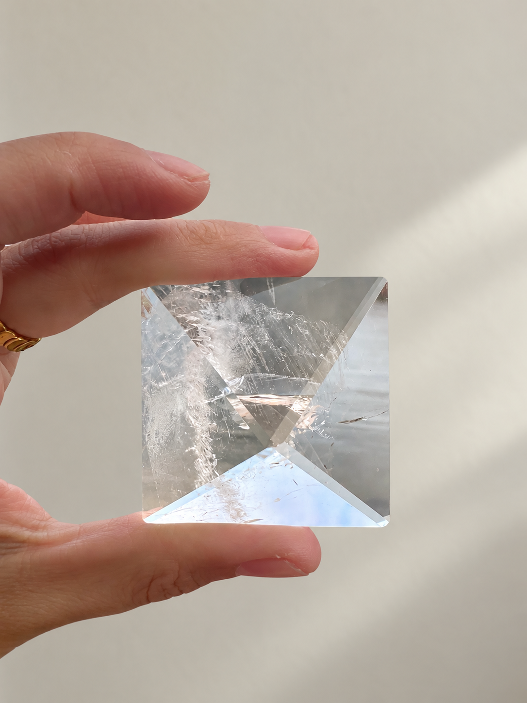 Natural Clear Quartz Pyramid, detailed view 4 in soft indoor light.